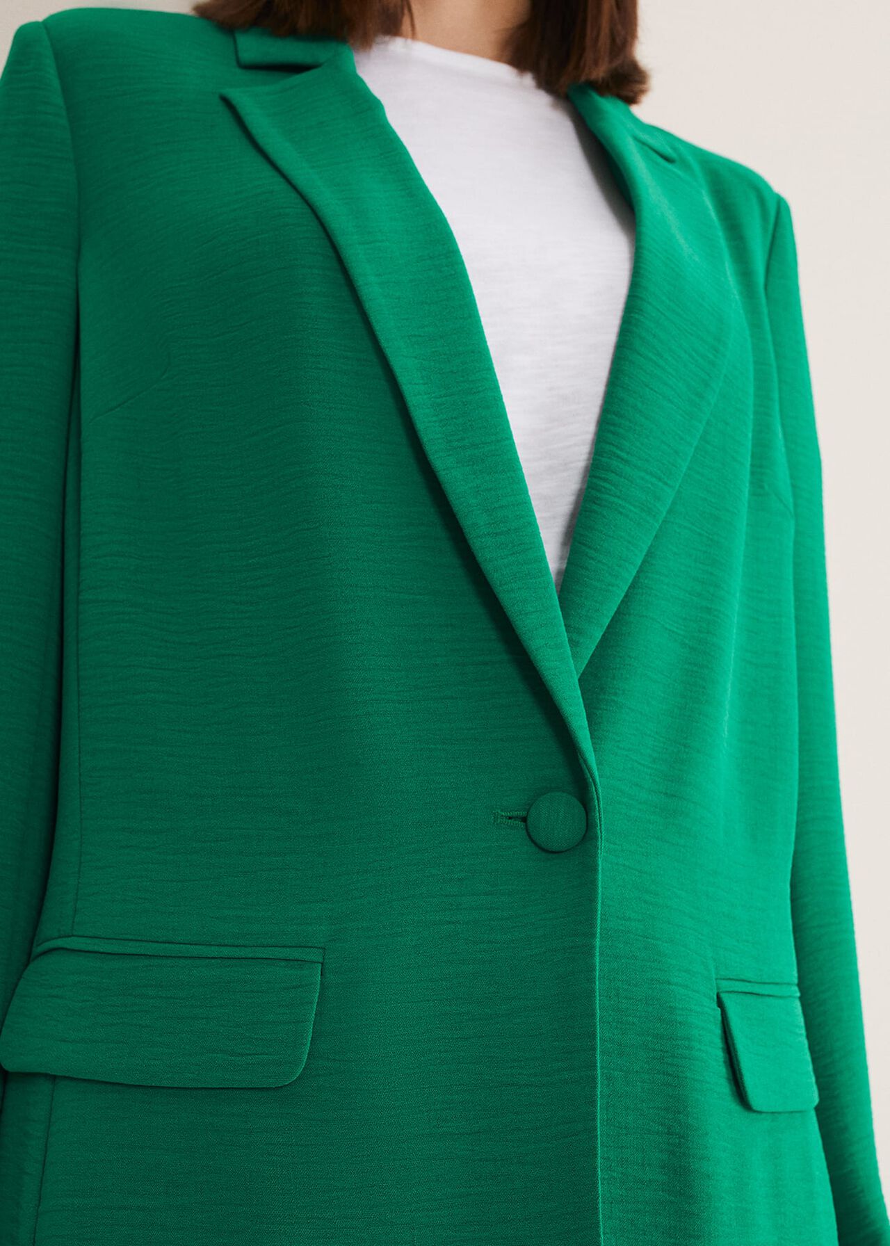 Woman wearing green suit co-ord