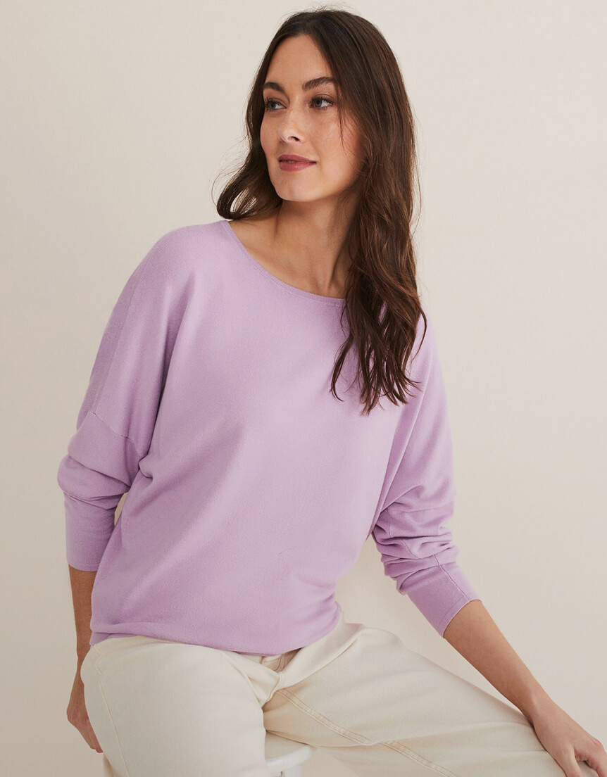 Woman wearing purple knitted jumper