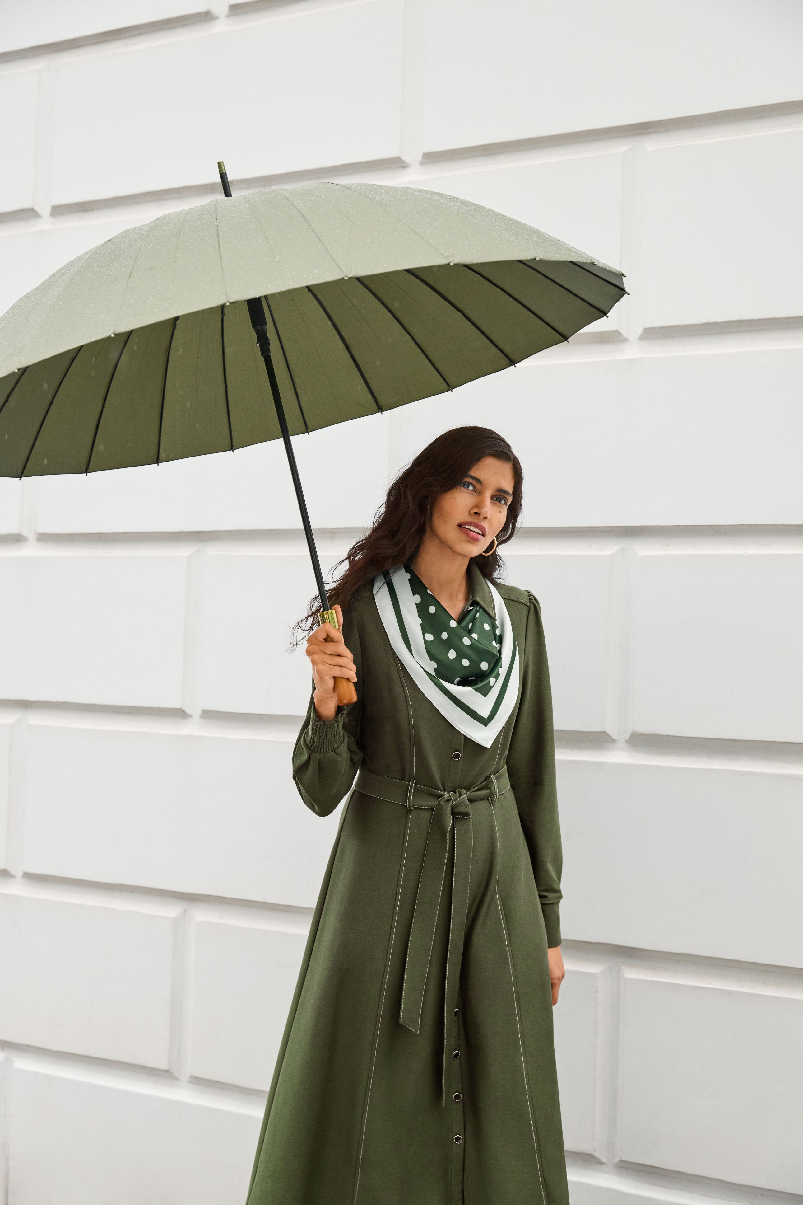 A woman wearing the Avenly ponte dress, front view.