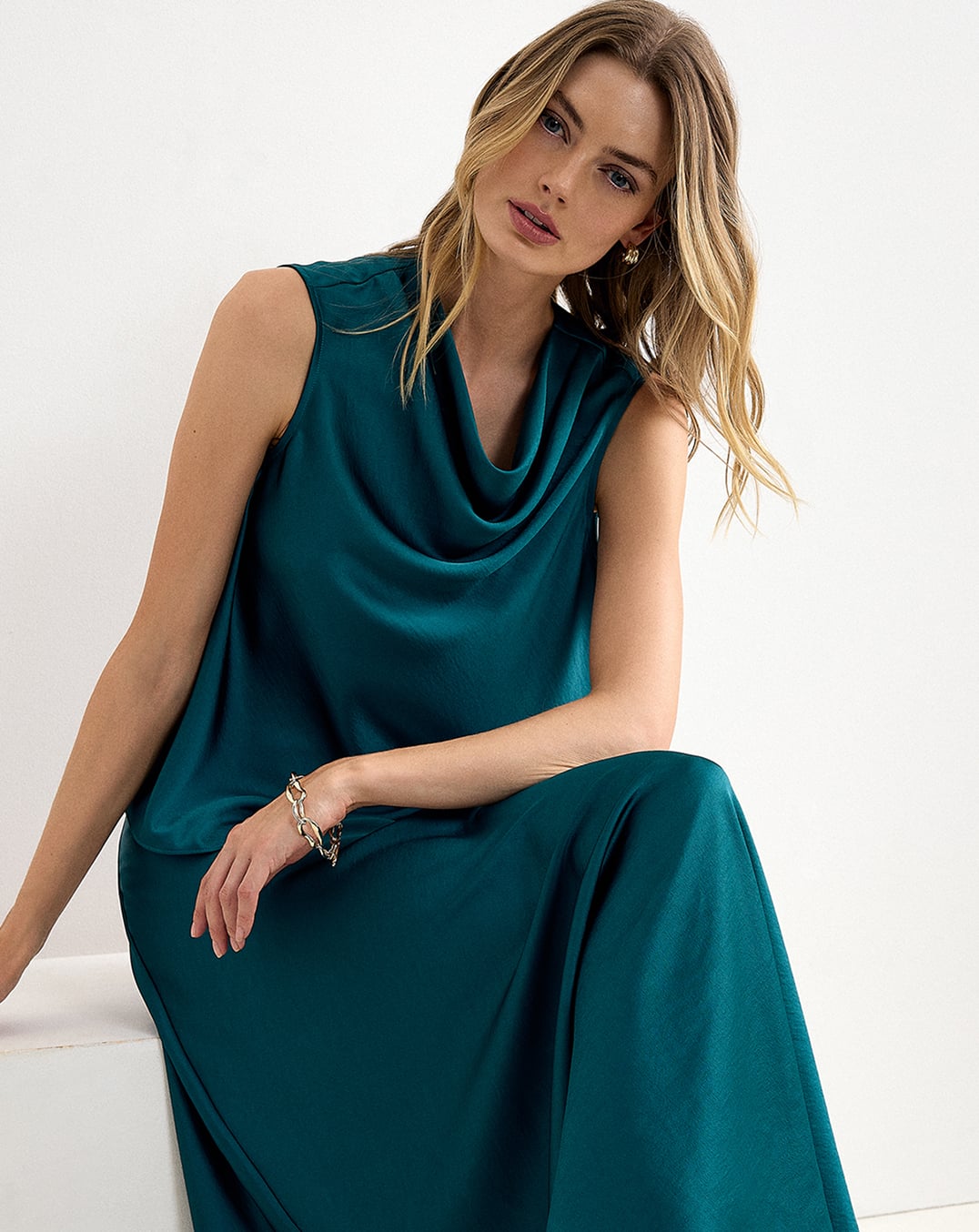 A woman wearing a Hobbs floral wide-leg jumpsuit.