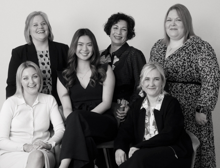 Six women wearing Phase Eight