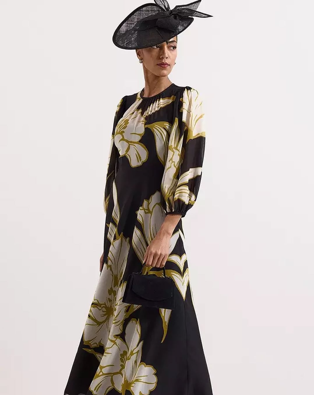A woman wearing a Hobbs floral printed maxi dress.