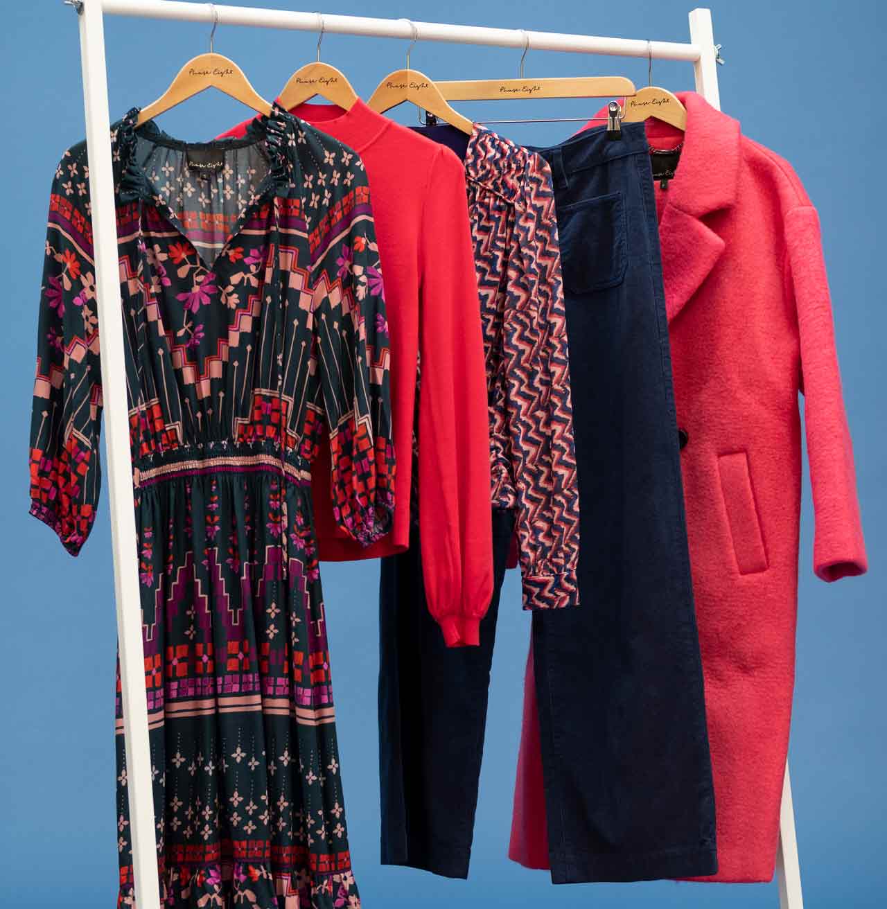 Rail shot with dress, jumper, jeans and coat