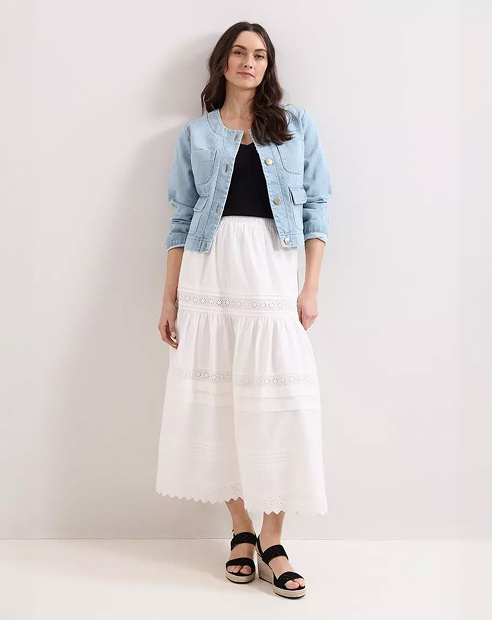 Woman in Phase Eight white maxi skirt