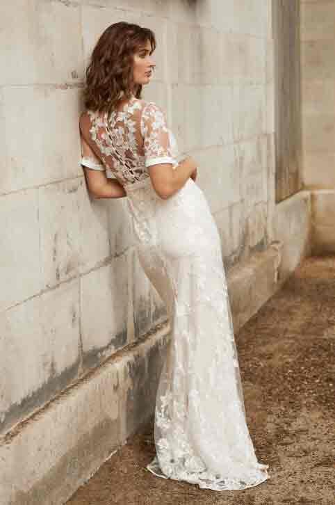 Woman modelling white lace wedding dress