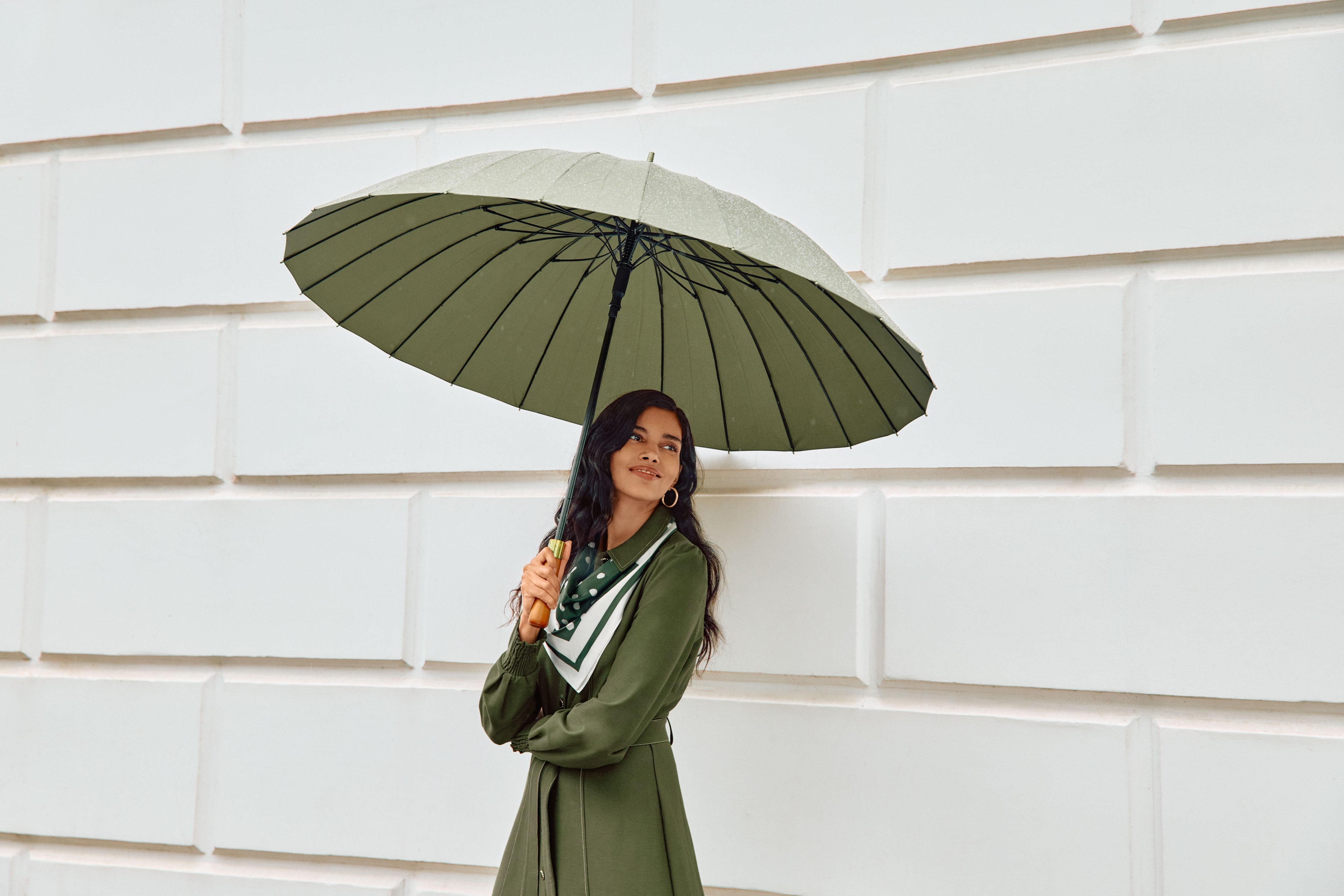 A woman wearing the Avenly ponte dress, side view.