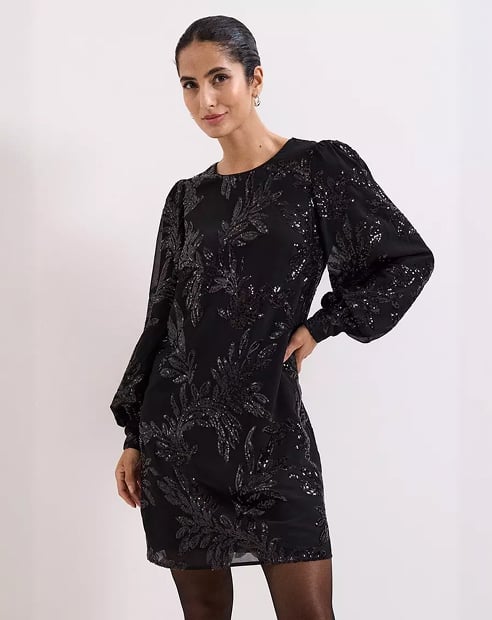 Woman in Phase Eight black dress
