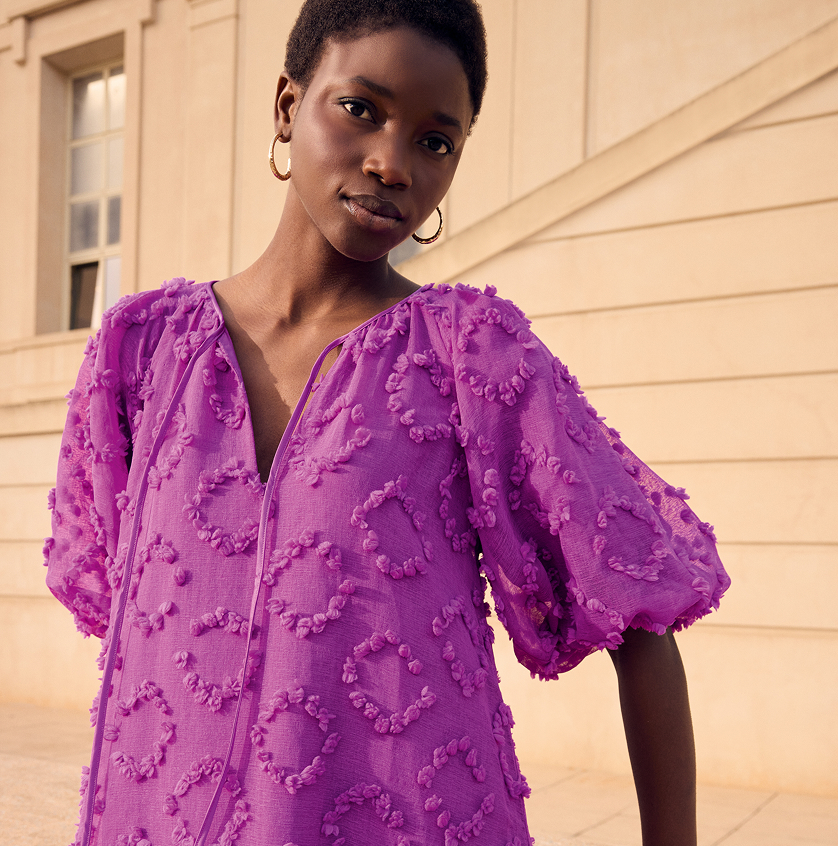 Woman wearing Phase Eight printed dress